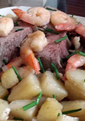 A picture of shrimp roast with greek seasoned potatoes.