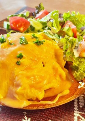 A picture of Fluffy Omurice with Plenty of Cheese Sauce.