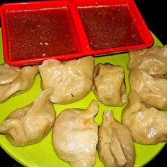 A picture of Mix Veg Stuffed Momos With Chutputey Tomato Chutney.