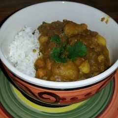 A picture of Potato Chick-Pea Curry W/Garlic Roasted Cauliflower - Serve W/Basmati Rice & Cha.