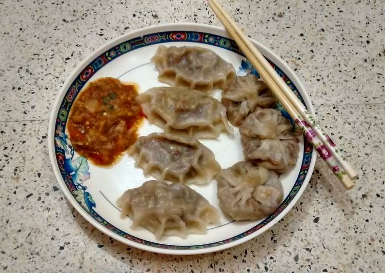 Steamed veg Dumplings with spicy tomato chutney