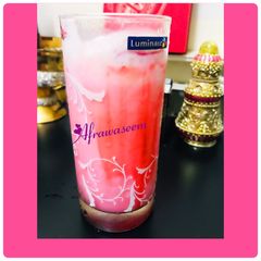 A picture of Laban up with scoop of strawberry cheese cake ice cream.