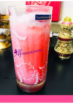A picture of Laban up with scoop of strawberry cheese cake ice cream.