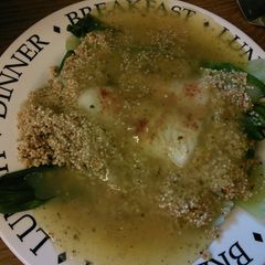 A picture of Sea bass on a bed of pak Choy & quinoa with lemon sauce 420 calories.