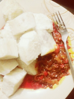A picture of Boiled yam with onion/pepper sauce.