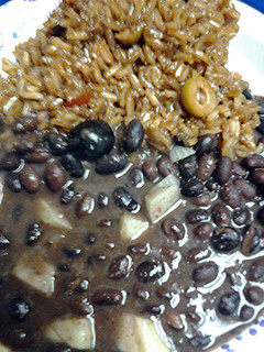 A picture of Olive rice and malta with black beans.