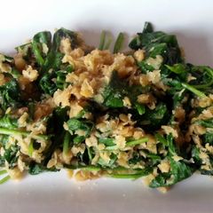 A picture of spinach and red lentils.
