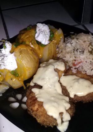 A picture of Cajun Fried Chicken with yummy sides:).