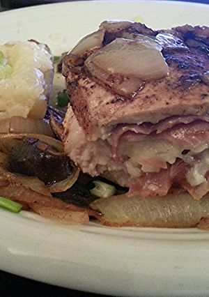 A picture of Double Cut Pork Chop Stuffed with Prosciutto & Italian Cheese.