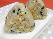 A picture of rice ball with seaweed