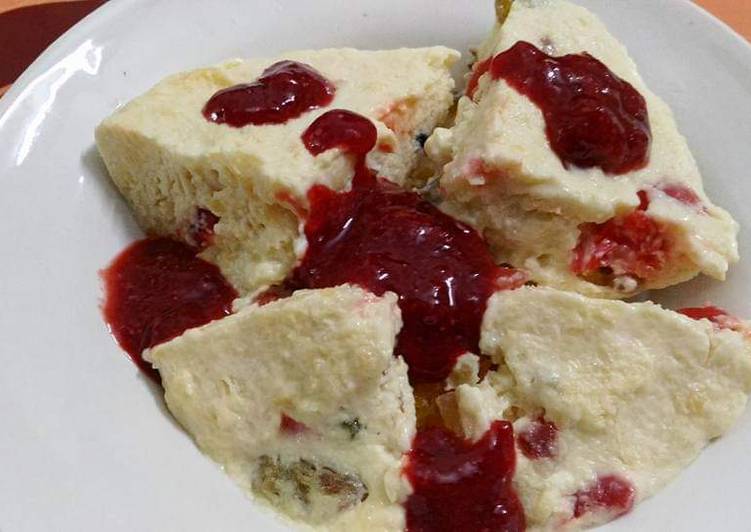 Butterscotch pudding with strawberry sauce