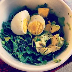A picture of Delicious Kale and Avocado with Coddled Egg.