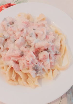Una foto de Fideos caseros con salsa parisienne