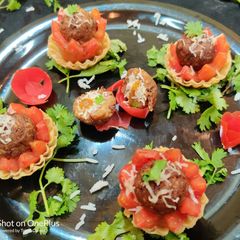A picture of Baked Cheese burst rajma stuffed Tomato Tarts.