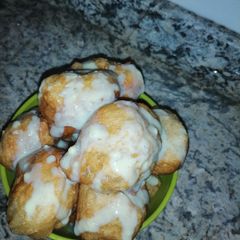 A picture of Milk drizzled puff puff.