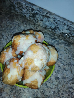 A picture of Milk drizzled puff puff.