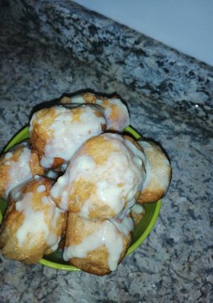 A picture of Milk drizzled puff puff.