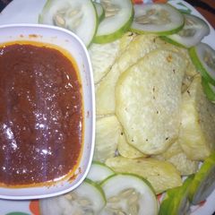 A picture of Fried yam with stew.