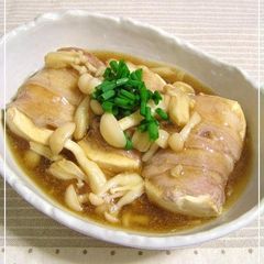 A picture of Tofu Wrapped with Pork Served with Thick Mushroom Sauce.