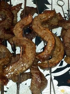 A picture of Steak on a stick.