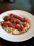 Grilled lamb and tomato kabobs with mushroom, lemon, amd parmesan couscous