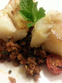 A picture of Pan seared cod with homemade chorizo.