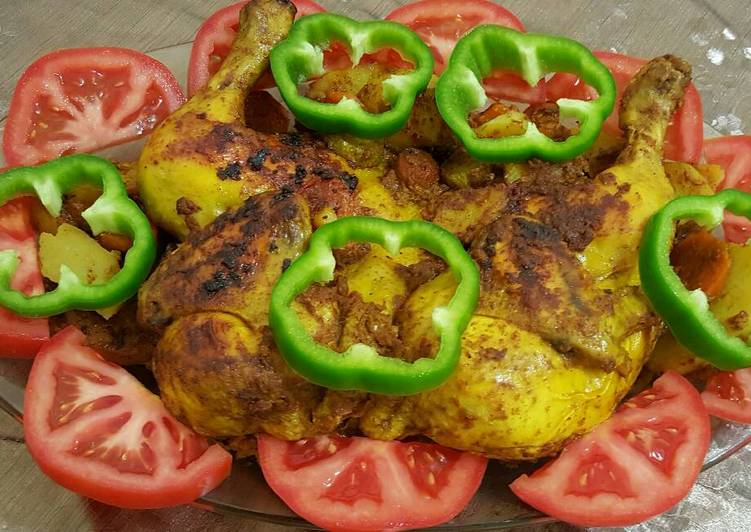 دجاجة مشوية بالفرن مع الفلفل والبندورة