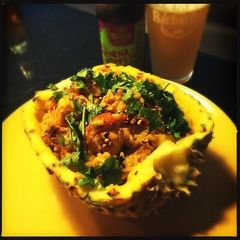 A picture of Pineapple Thai Rice with Jumbo Shrimp and Chicken.