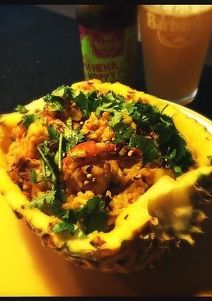 A picture of Pineapple Thai Rice with Jumbo Shrimp and Chicken.