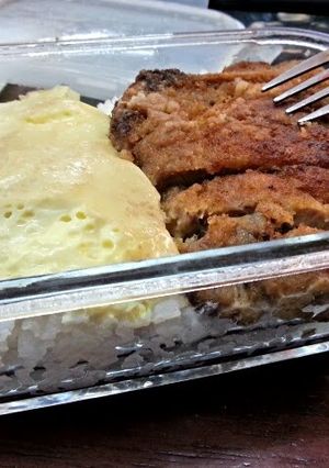 A picture of Bread Crumb Pork Chop and Steam Egg Lunch Box.