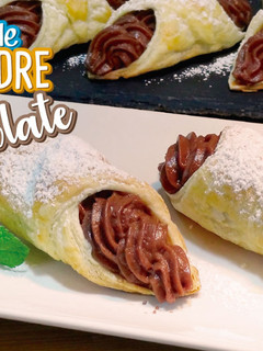 Una foto de Cañas de hojaldre rellenas de crema de chocolate