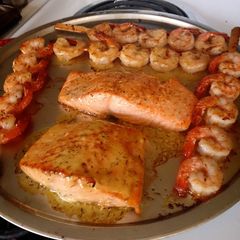 A picture of Salmon with Shrimp skewers.