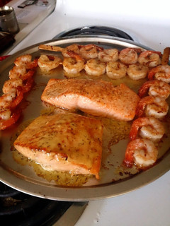 A picture of Salmon with Shrimp skewers.