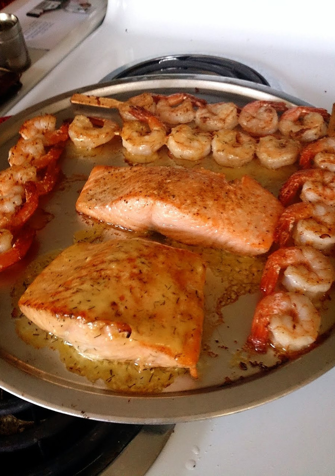A picture of Salmon with Shrimp skewers.
