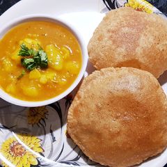 A picture of Aloo Sabji and Poori.