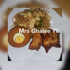 Jollof sphagetti with moimoi and fried chicken A picture of Jollof sphagetti with moimoi and fried chicken.