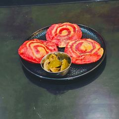 A picture of Pinwheel Beetroot Pulp Poori.