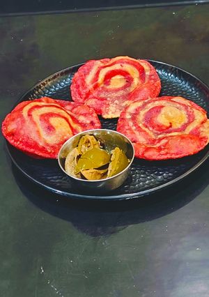 A picture of Pinwheel Beetroot Pulp Poori.