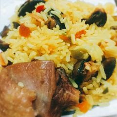 A picture of Tumeric rice with snails.