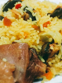 A picture of Tumeric rice with snails.