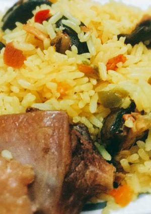 A picture of Tumeric rice with snails.