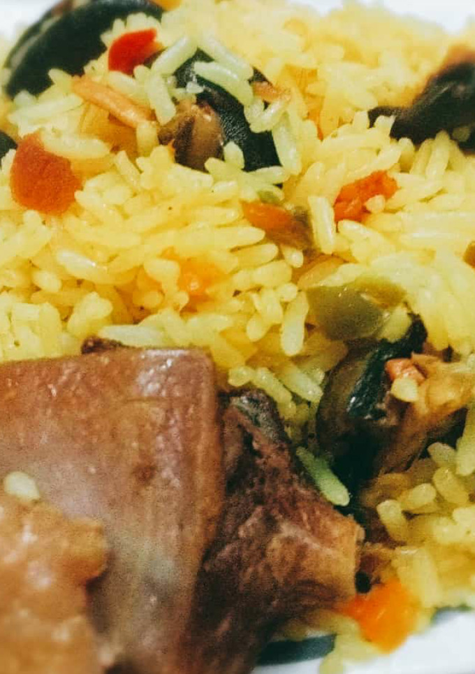 A picture of Tumeric rice with snails.
