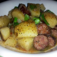 A picture of Smothered smoked sausage and potatoes.