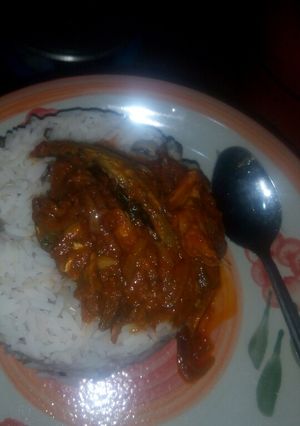 A picture of Rice and beans with smoked fish stew.