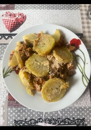 A picture of Baked Potato and Meat Dish.