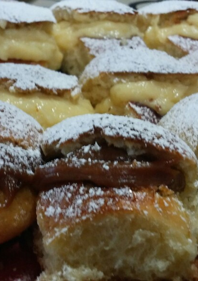 Una foto de Pancitos dulces rellenos con dulce de leche y crema pastelera