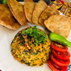 A picture of Green grams splits and spinach subji.
