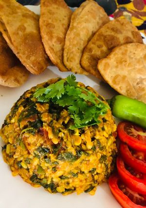 A picture of Green grams splits and spinach subji.