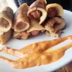A picture of Chicken Frank's in pancakes Rolls.