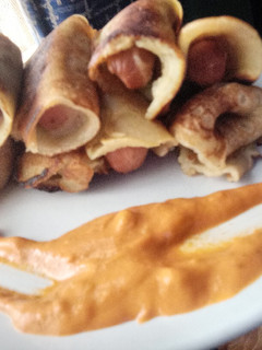 A picture of Chicken Frank's in pancakes Rolls.